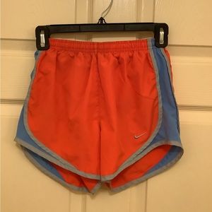 Women’s Orange with Blue sides Nike Tempo shorts, Size X-Small